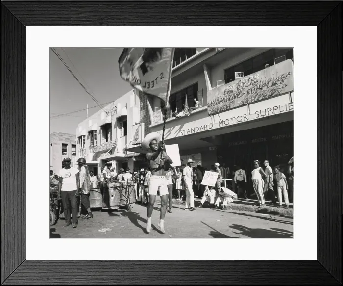 Framed Print : A young man in shorts dances and waves a flag about at the Port of Spain Carnival, Trinidad, West Indies. Date: 1968 Framed Print : A young man in shorts dances and waves a flag about at the Port of Spain Carnival, Trinidad, West Indies. Date: 1968