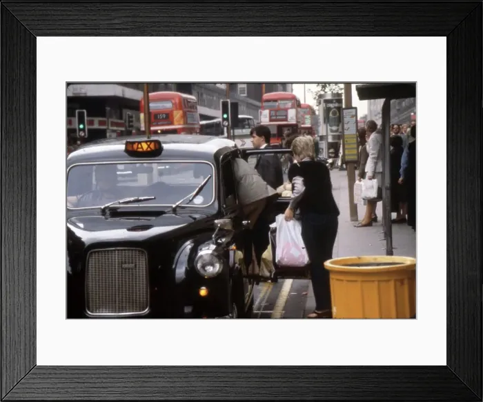 Framed Print : Two smartly dressed women pile into a London black taxi cab, after a spot of shopping on Oxford Street. Date: 1981 Framed Print : Two smartly dressed women pile into a London black taxi cab, after a spot of shopping on Oxford Street. Date: 1981