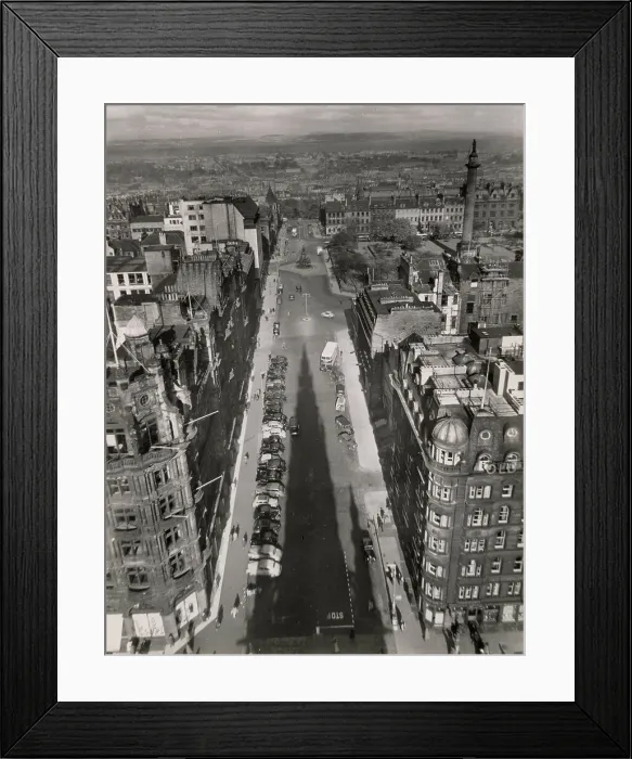 Framed Print : A fine overview of St. David's Street, Edinburgh, Scotland, taken from the Sir Walter Scott Monument, with its giant shadow cast up the length of this impressive street. Date: 1950s Framed Print : A fine overview of St. David's Street, Edinburgh, Scotland, taken from the Sir Walter Scott Monument, with its giant shadow cast up the length of this impressive street. Date: 1950s
