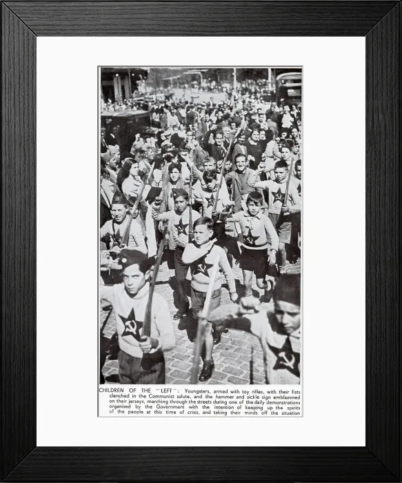 Framed Print : Children, dressed in Communist jumpers and with toy rifles, marching through the streets of Madrid during the Spanish Civil War, 1936. The children are shown giving the Socialist clenched-fist salute. Date: 1936 Framed Print : Children, dressed in Communist jumpers and with toy rifles, marching through the streets of Madrid during the Spanish Civil War, 1936. The children are shown giving the Socialist clenched-fist salute. Date: 1936