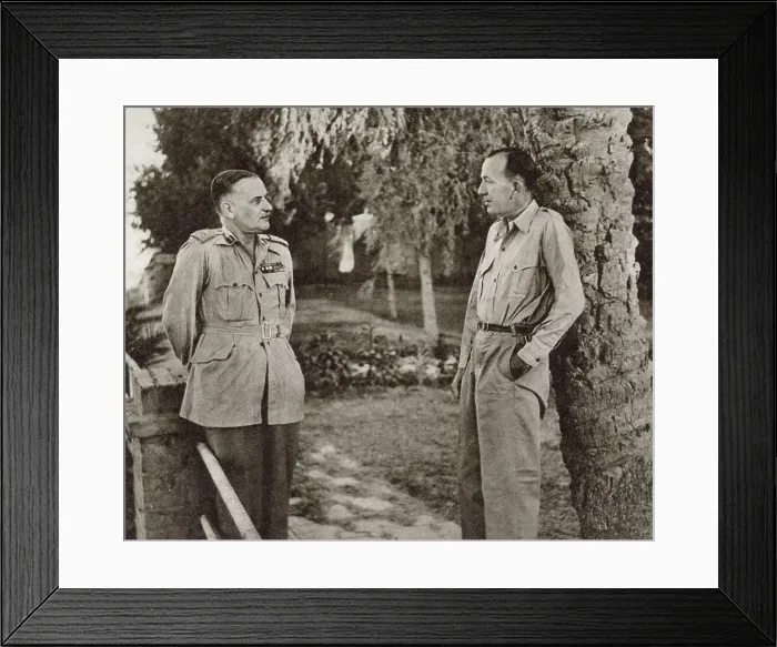 Framed Print : Noel Coward (1899 - 1973) (right), English playwright, actor and composer, talking to Lieut-General Sir H. Pownall during a tour of North Africa in 1943. Coward was then travelling in the region, entertaining British troops. Date: 1943 Framed Print : Noel Coward (1899 - 1973) (right), English playwright, actor and composer, talking to Lieut-General Sir H. Pownall during a tour of North Africa in 1943. Coward was then travelling in the region, entertaining British troops. Date: 1943