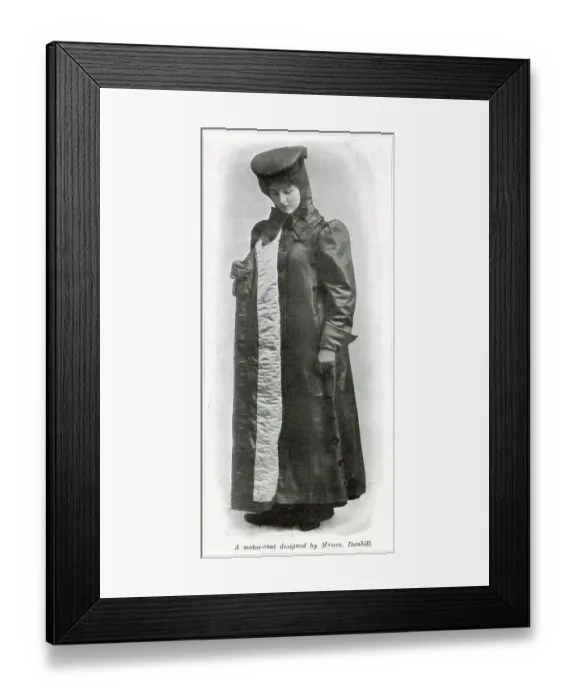 Framed Print : Lady motorist wearing a quilted full length protective motor-coat against the bad weather designed by Dunhill. Date: 1907 Framed Print : Lady motorist wearing a quilted full length protective motor-coat against the bad weather designed by Dunhill. Date: 1907