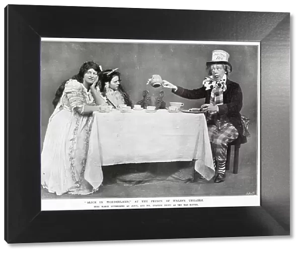 Alice in Wonderland Mad Hatters tea party starring Marie Studholme as Alice and Stanley Brett as the Mad Hatter at The Prince of Wales Theatre, West End, London. Date: 1907