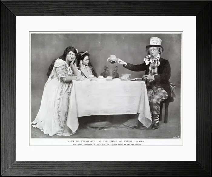 Framed Print : Alice in Wonderland Mad Hatters tea party starring Marie Studholme as Alice and Stanley Brett as the Mad Hatter at The Prince of Wales Theatre, West End, London. Date: 1907