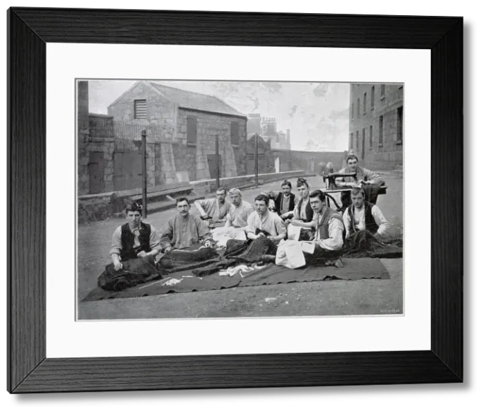 Framed Print : Representing the tailors of the regiment making kilts for the Gordon Highlanders in the barrack-yard at Aberdeen. Date: circa 1902 Framed Print : Representing the tailors of the regiment making kilts for the Gordon Highlanders in the barrack-yard at Aberdeen. Date: circa 1902