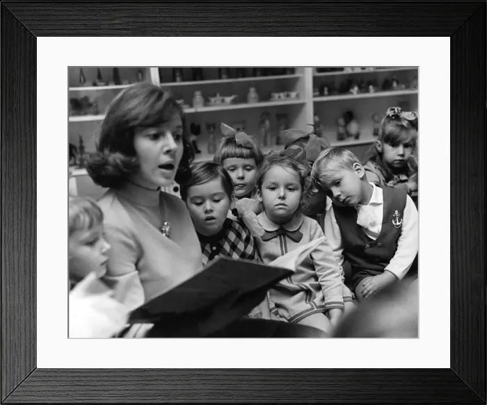 Framed Print : Teacher reading to children Framed Print : Teacher reading to children