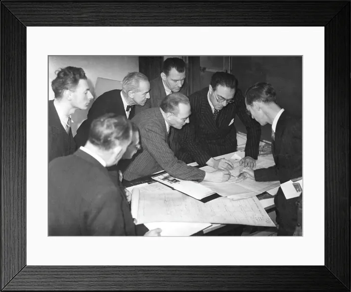 Framed Print : Daily Worker staff examining building alteration plans Framed Print : Daily Worker staff examining building alteration plans