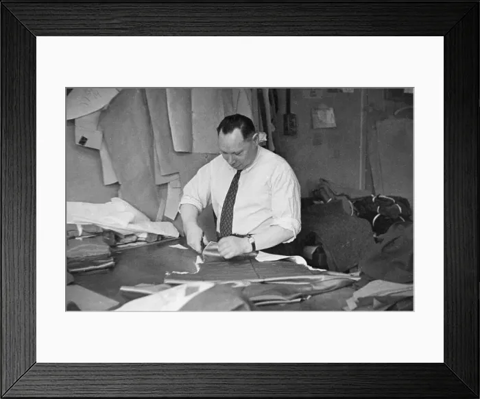 Framed Print : Cutter at work on a garment Framed Print : Cutter at work on a garment