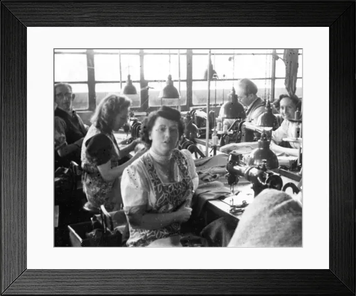Framed Print : Men and women in a tailors workshop Framed Print : Men and women in a tailors workshop