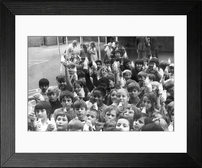 Framed Print : Children drinking milk in a playground, Woolwich, London Framed Print : Children drinking milk in a playground, Woolwich, London