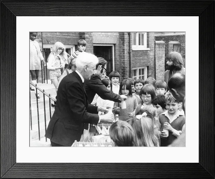 Framed Print : Teachers distributing milk to children, Woolwich, London Framed Print : Teachers distributing milk to children, Woolwich, London