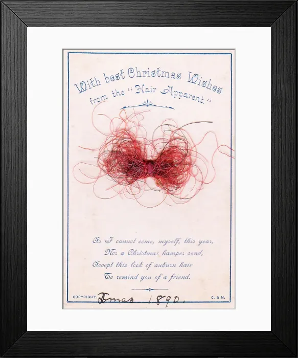 Framed Print : Strands of red hair with comic verse on a Christmas card Framed Print : Strands of red hair with comic verse on a Christmas card