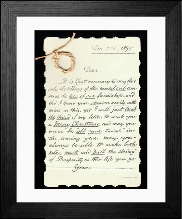 Framed Print : Piece of string with comic letter on a Christmas card Framed Print : Piece of string with comic letter on a Christmas card