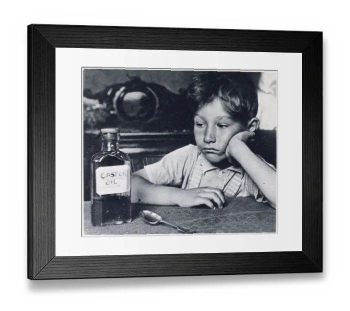 Framed Print : Children were force-fed spoonfuls of castor oil for treatment of constipation. Date: 1939 Framed Print : Children were force-fed spoonfuls of castor oil for treatment of constipation. Date: 1939