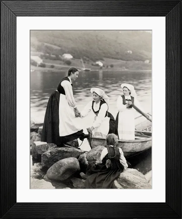 Framed Print : Norwegian woman traditional dress climbing out of boat Framed Print : Norwegian woman traditional dress climbing out of boat