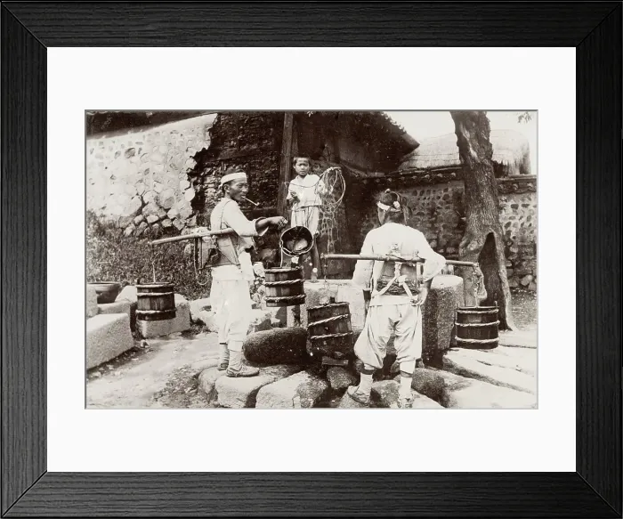 Framed Print : Korea: men taking water from a well Framed Print : Korea: men taking water from a well