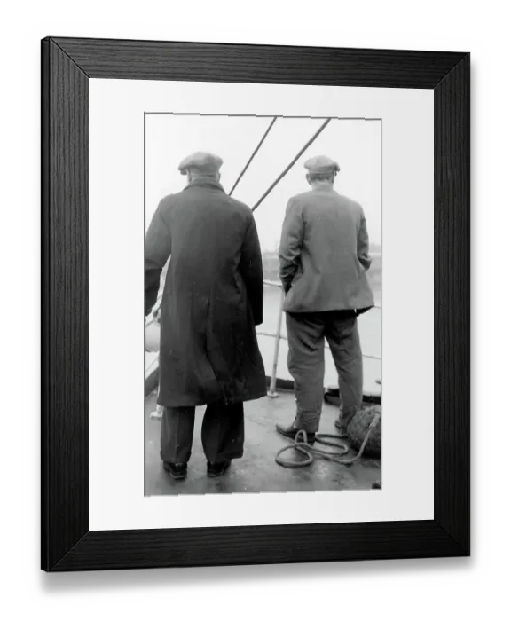 Framed Print : Life on a North Sea trawler - two men on deck in raincoat, jacket, and flat caps, close to shore. Date: 1960s Framed Print : Life on a North Sea trawler - two men on deck in raincoat, jacket, and flat caps, close to shore. Date: 1960s