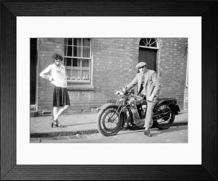 Framed Print : Man on a motorcycle with girlfriend Framed Print : Man on a motorcycle with girlfriend