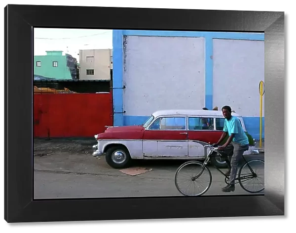 Man on bike, street, Havana, Cuba