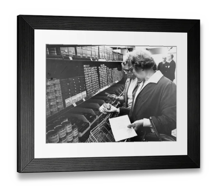 Framed Print : London shoppers with conversion tables - Decimilisation Framed Print : London shoppers with conversion tables - Decimilisation