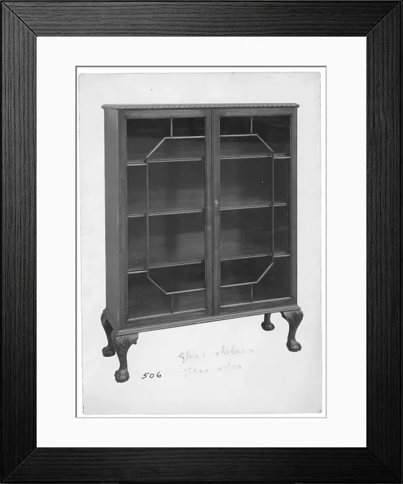 Framed Print : Glass-fronted Mahogany bookcase Framed Print : Glass-fronted Mahogany bookcase