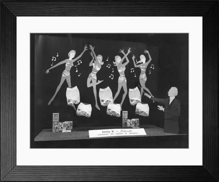 Framed Print : Silhouette, Little X corsets with Lycra, window display Framed Print : Silhouette, Little X corsets with Lycra, window display