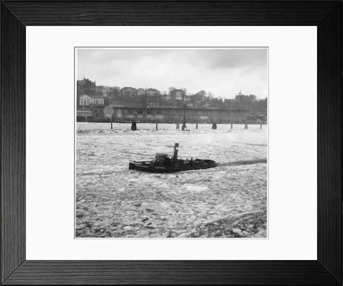 Framed Print : A tug-boat sailing through icy waters Framed Print : A tug-boat sailing through icy waters