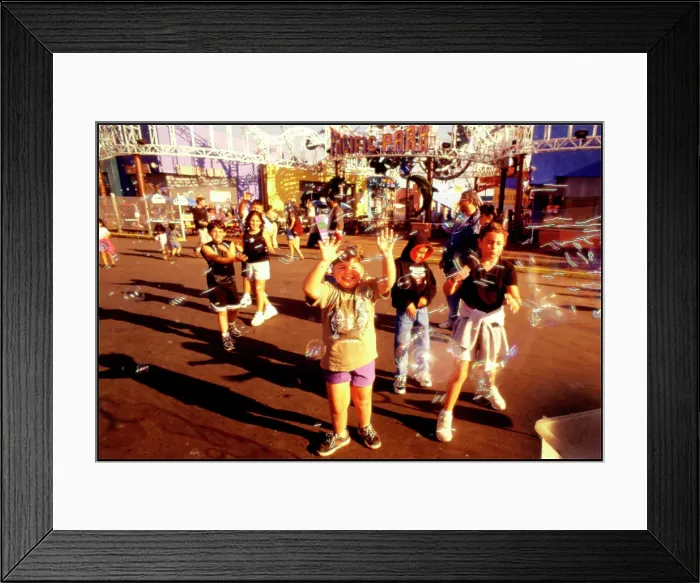 Framed Print : USA - Children chasing soapbubbles Santa Monica beach Framed Print : USA - Children chasing soapbubbles Santa Monica beach