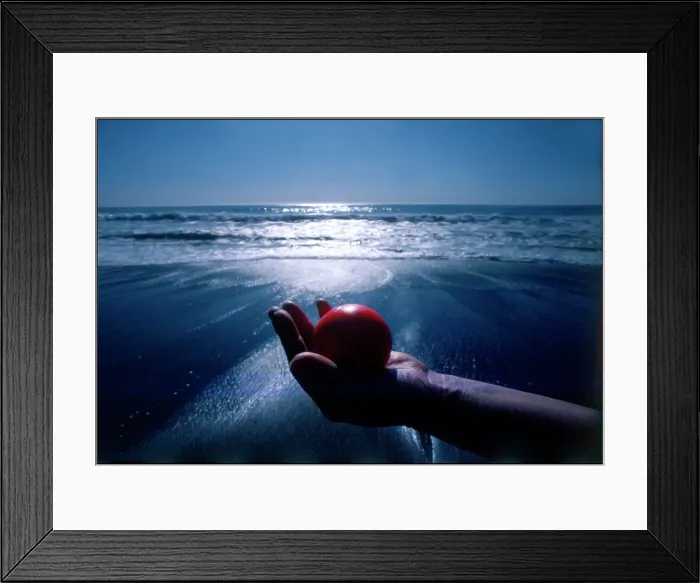 Framed Print : Hand holding red ball Moonstone Beach California Framed Print : Hand holding red ball Moonstone Beach California