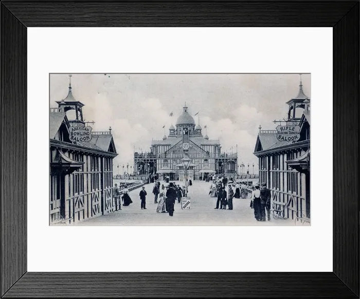 Framed Print : View along Eastbourne pier with sign for Rifle Saloon Framed Print : View along Eastbourne pier with sign for Rifle Saloon