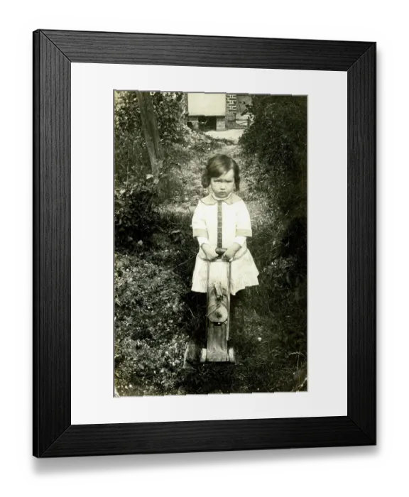 Framed Print : Unhappy young girl with her toy wooden horse Framed Print : Unhappy young girl with her toy wooden horse
