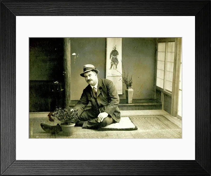 Framed Print : Man seated on the floor in a Japanese house Framed Print : Man seated on the floor in a Japanese house