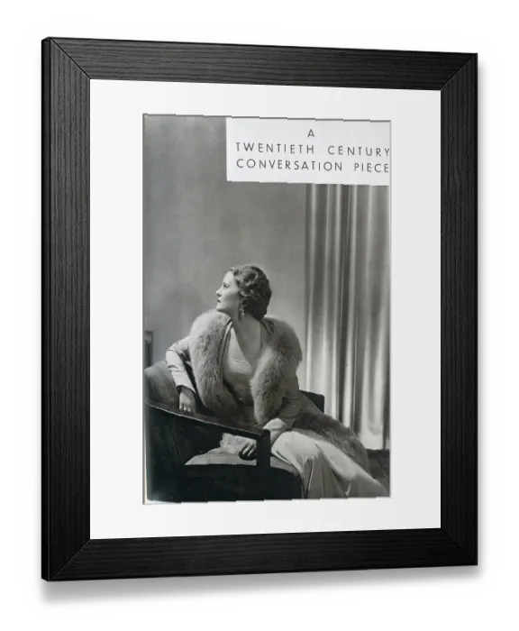 Framed Print : Averil Streatfield (1911-1977) is here seen modelling a crepe romain gown and a coat bordered with grey fox, by designer Norman Hartnell (1901-1979). Date: 1932 Framed Print : Averil Streatfield (1911-1977) is here seen modelling a crepe romain gown and a coat bordered with grey fox, by designer Norman Hartnell (1901-1979). Date: 1932