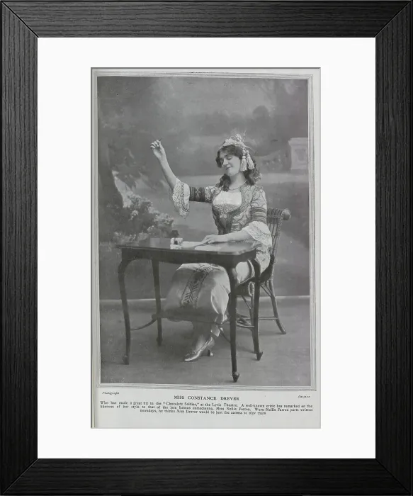 Framed Print : Constance Drever, actress (1880-1948), theatrical portrait, seated at writing desk. Miss Drever had made a recent hit in The Chocolate Soldier'at the Lyric Theatre, and had been compared to the late comedienne, Nellie Farren Framed Print : Constance Drever, actress (1880-1948), theatrical portrait, seated at writing desk. Miss Drever had made a recent hit in The Chocolate Soldier'at the Lyric Theatre, and had been compared to the late comedienne, Nellie Farren