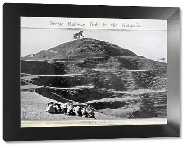 One-Tree Hill, Auckland, outdoor scenic photograph, with spectators in the foreground. Captioned, Scenic Railway Golf in the Antipodes, where an ingenious