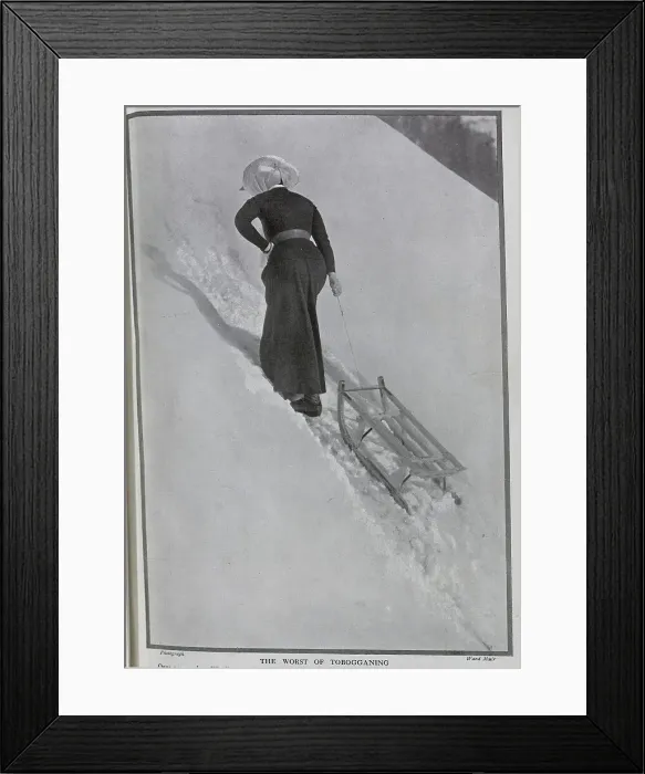 Framed Print : Photograph of woman climbing snowy hill, pulling toboggan behind her, at St Beatenberg, Lake Thun, Switzerland, by Ward Muir. Captioned, Jill - to Date! and The Worst of Tobogganing'. Date: 1910 Framed Print : Photograph of woman climbing snowy hill, pulling toboggan behind her, at St Beatenberg, Lake Thun, Switzerland, by Ward Muir. Captioned, Jill - to Date! and The Worst of Tobogganing'. Date: 1910