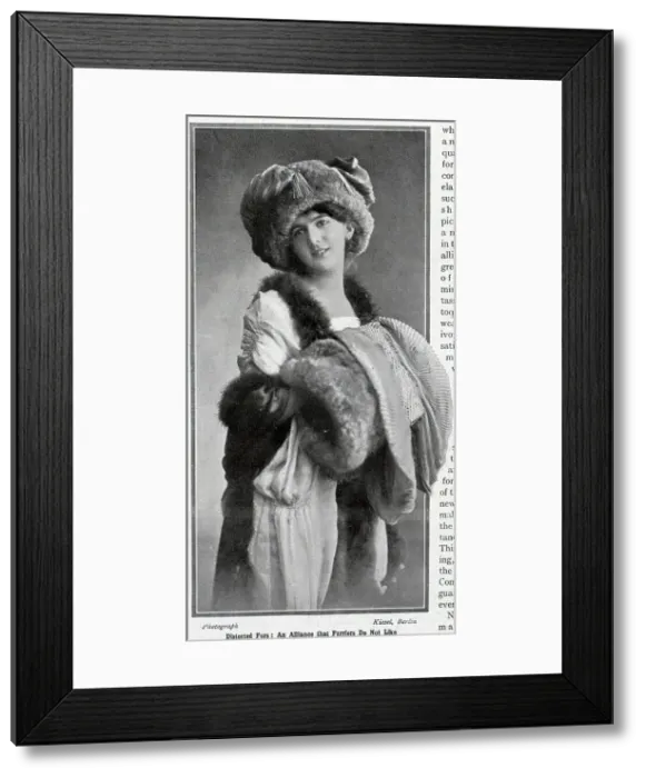 Framed Print : Woman in furs, model wearing fur hat, muff, and stole. Captioned, Distorted furs, an alliance that Furriers do not like'. From an article, Frocks, Furs and Furbelows, by Mrs Jack May. Date: 1910 Framed Print : Woman in furs, model wearing fur hat, muff, and stole. Captioned, Distorted furs, an alliance that Furriers do not like'. From an article, Frocks, Furs and Furbelows, by Mrs Jack May. Date: 1910