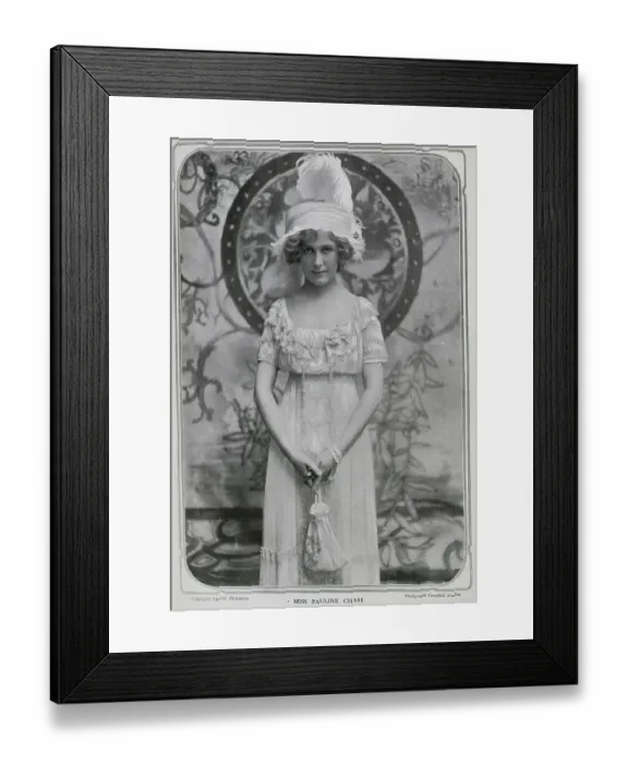 Framed Print : Pauline Chase (1885-1962), American actress, studio portrait in gown and feathered hat. Captioned, Pan Re-Petered'. Chase had recently returned to London from New York, to play Peter Pan at the Duke of York's theatre Framed Print : Pauline Chase (1885-1962), American actress, studio portrait in gown and feathered hat. Captioned, Pan Re-Petered'. Chase had recently returned to London from New York, to play Peter Pan at the Duke of York's theatre
