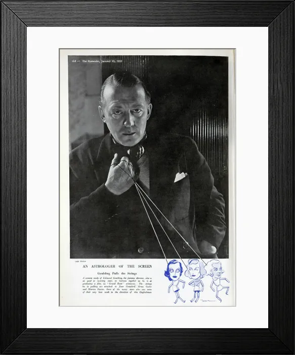 Framed Print : Edmund Goulding, director, studio portrait with puppet strings. Captioned, An Astrologer of The Screen: Goulding Pulls the Strings'. With description, A camera study of Edmund Goulding, the famous director Framed Print : Edmund Goulding, director, studio portrait with puppet strings. Captioned, An Astrologer of The Screen: Goulding Pulls the Strings'. With description, A camera study of Edmund Goulding, the famous director