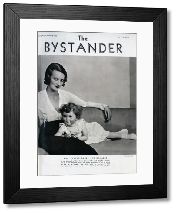 Framed Print : Mrs Vyvyan Drury (1907-1996) and daughter, Romayne, studio portrait seated on couch. With description, A new photograph of Mrs Vyvyan Drury and her small daughter, Romayne, who is a most fascinating person Framed Print : Mrs Vyvyan Drury (1907-1996) and daughter, Romayne, studio portrait seated on couch. With description, A new photograph of Mrs Vyvyan Drury and her small daughter, Romayne, who is a most fascinating person