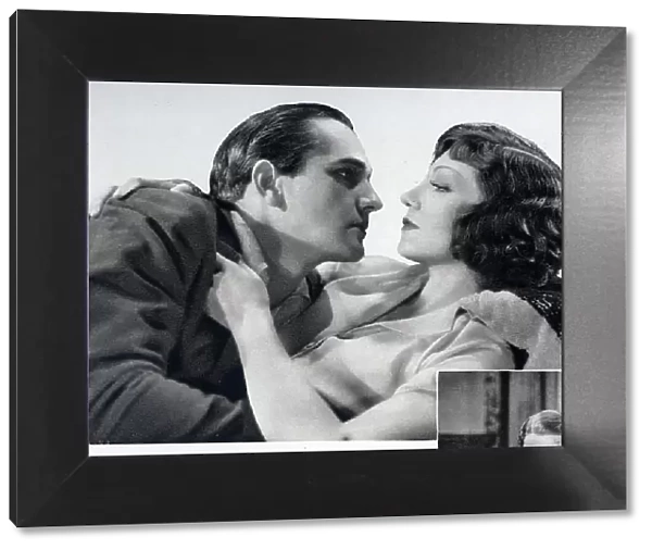 Photograph of Claudette Colbert (1903-1996), actress and Fredric March (1897-1975), actor in 'To-night is Ours'. With description, Claudette Colbert and Fredric March in 'To-night is Ours