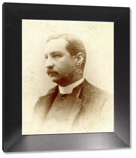 Clergyman in cabinet photograph