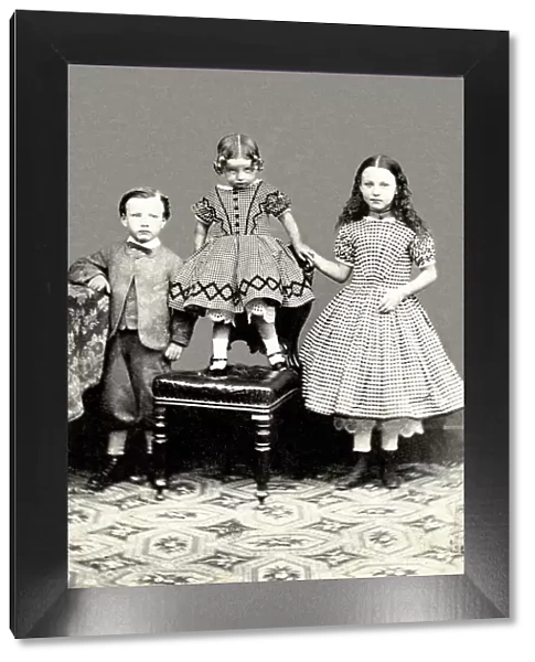 Studio portrait of three children on a carte de visite