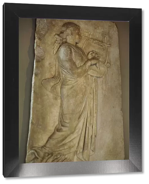 Hellenistic relief depicting a Muse playing the zither