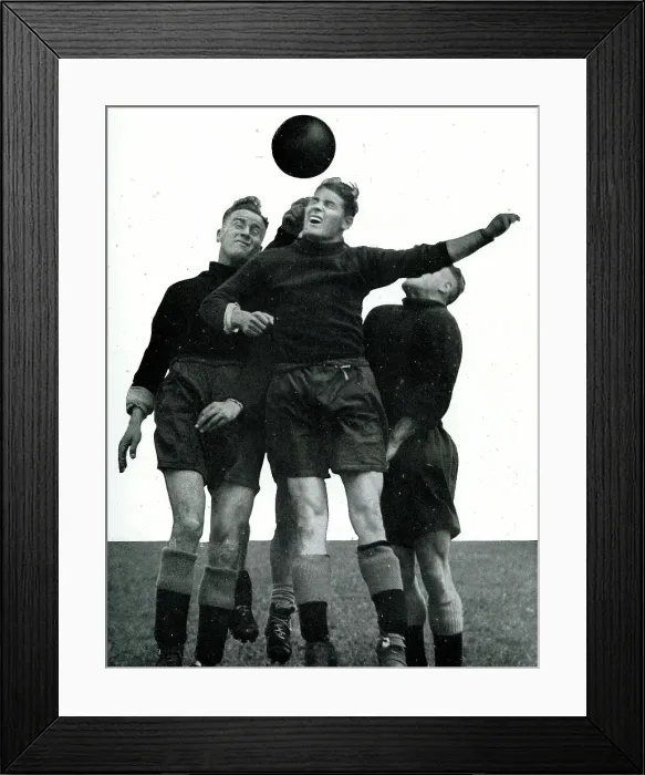 Framed Print : Manchester City footballers heading the ball Framed Print : Manchester City footballers heading the ball