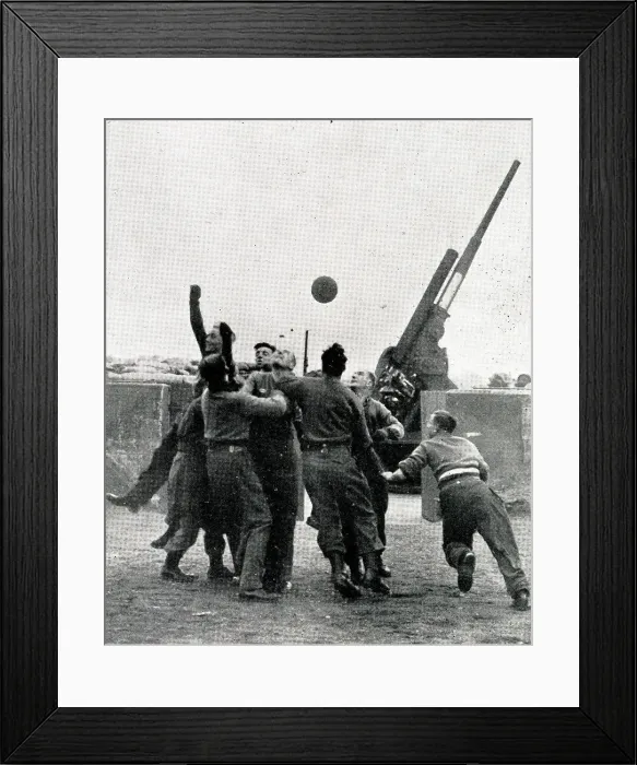 Framed Print : Anti-Aircraft crew members play football, WW2 Framed Print : Anti-Aircraft crew members play football, WW2