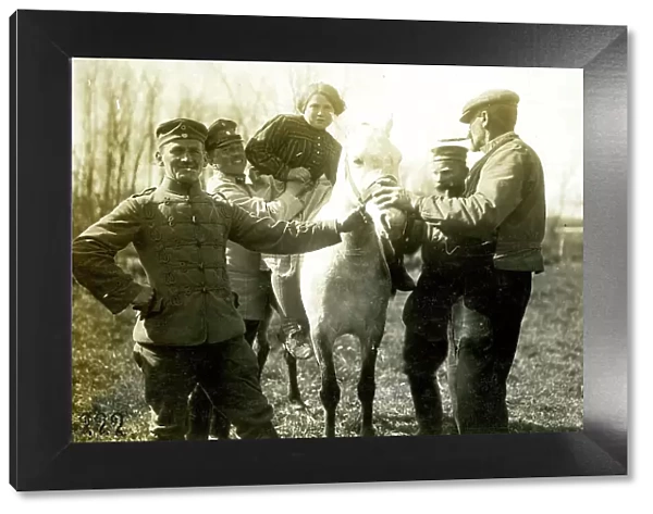 German soldiers help farmer's wife onto a horse, WW1