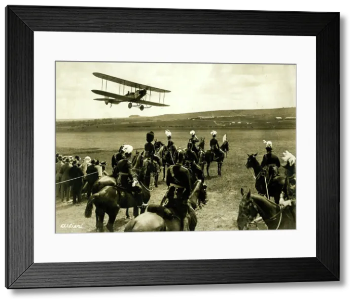 Framed Print : People in a field looking up at a biplane Framed Print : People in a field looking up at a biplane