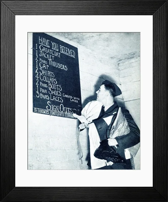 Framed Print : RAF recruit checking the kit list, WW2