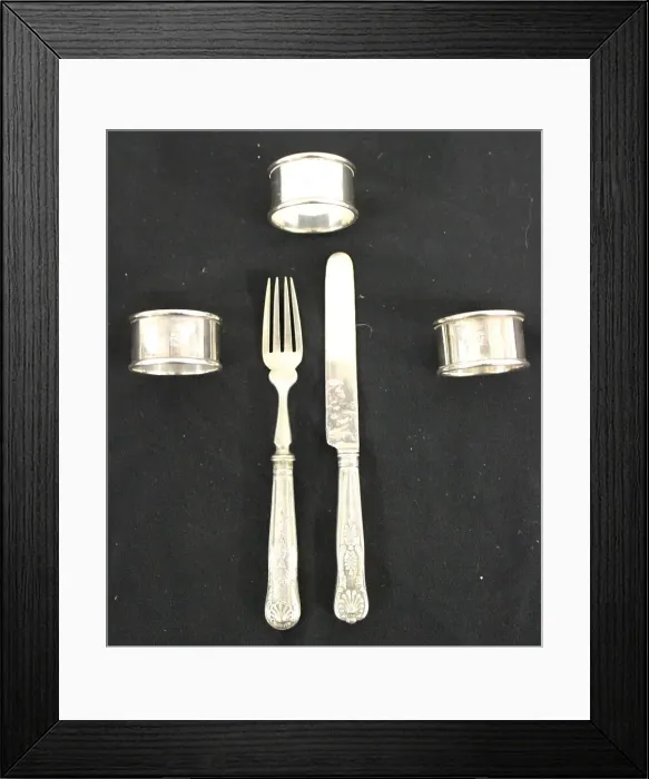Framed Print : Red Star Line - three metal napkin rings, knife and fork Framed Print : Red Star Line - three metal napkin rings, knife and fork